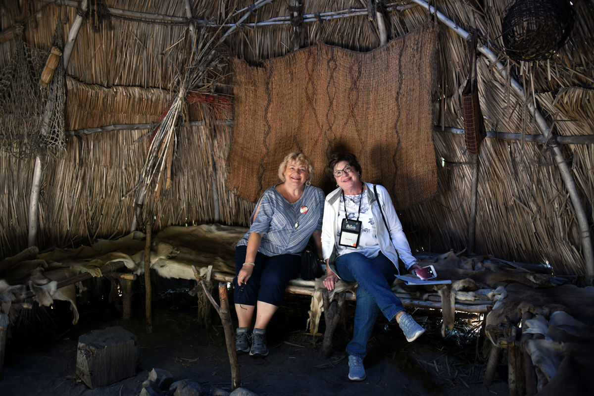 022 Bernice Mettenbrink and Susan Watt inside the Wampanoag hut.jpg